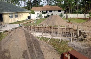 backyard swimming pool under construction - preparing excavation