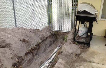 backyard swimming pool under construction - lying pipe system